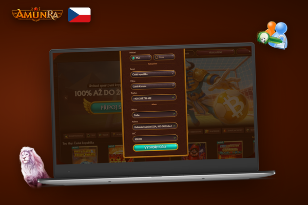 Hráč s mobilem u notebooku otevírá AmunRa Casino CZ registrace a herní nabídku